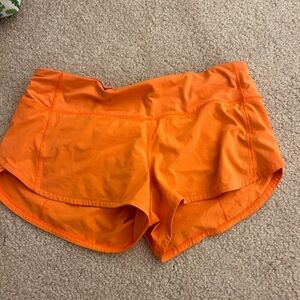 Orange LuluLemon Speed up shorts 2.5”